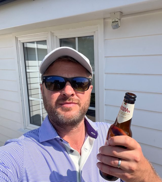 Nick, from Mack Hill Marketing, holding a beer
